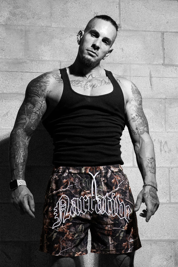 Signature Logo 5 inch inseam Shorts RealTree Camo, Model Pose 